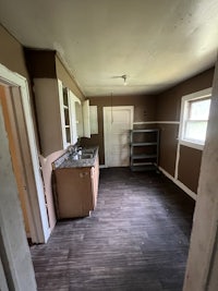a kitchen with a sink and a refrigerator